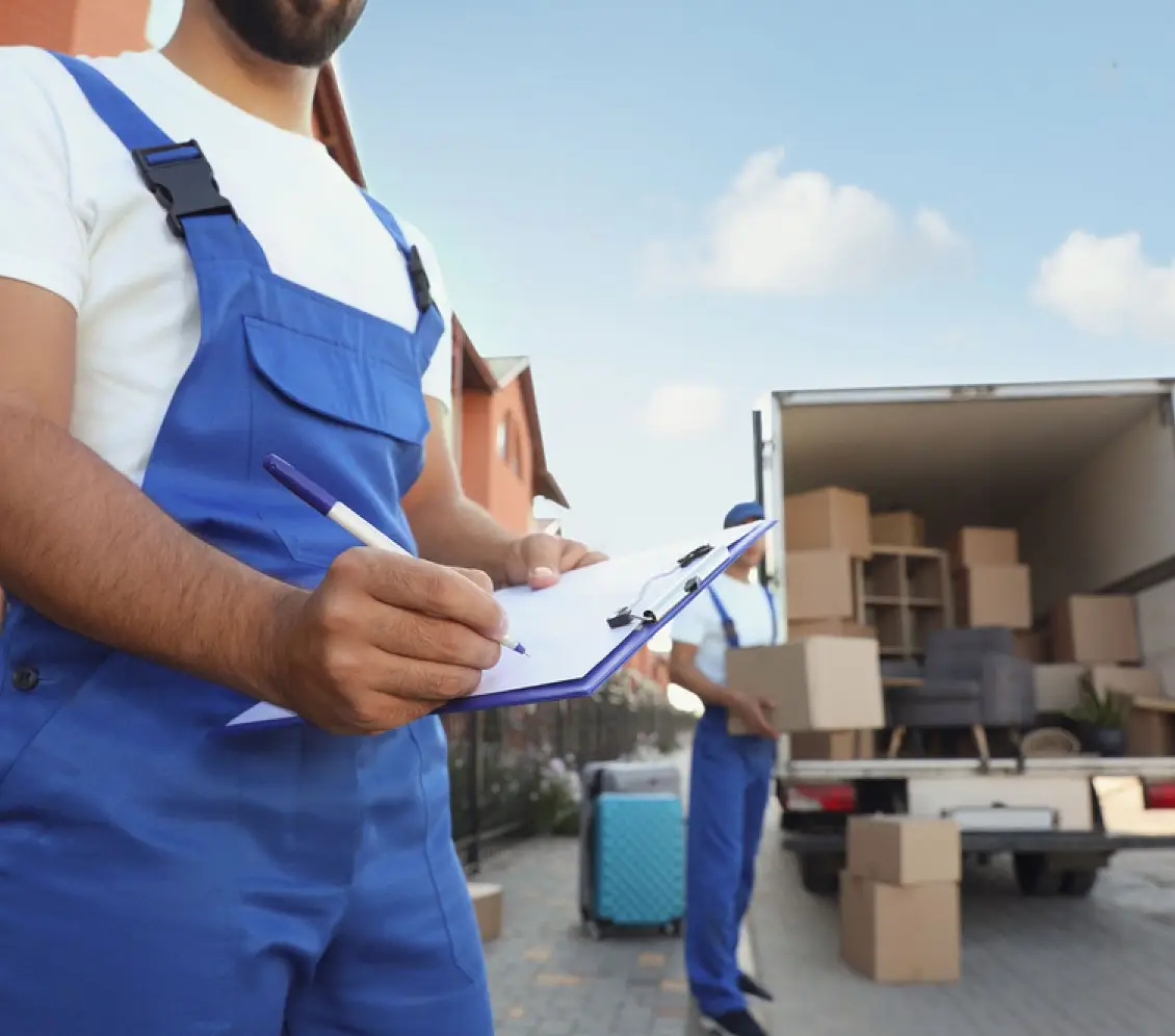 Professional movers loading truck with boxes. Moving services for your area. Get a free quote today!